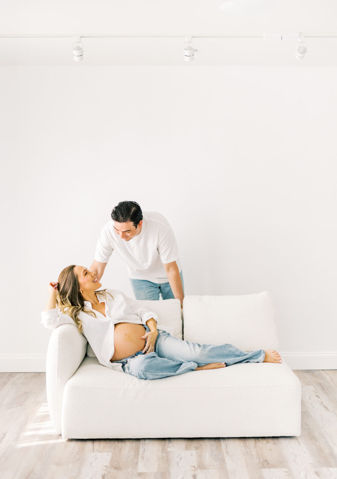 Expecting parents share laughter during Dallas maternity session