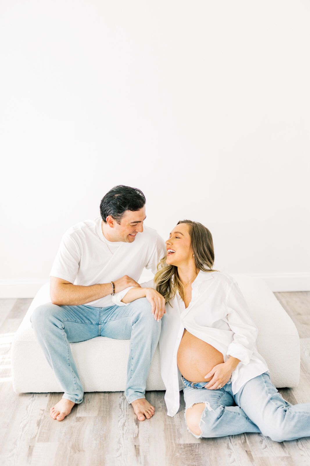 Expecting parents share laughter during Dallas maternity session