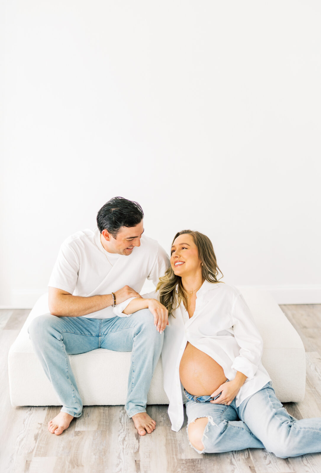 Expecting parents share laughter during Dallas maternity session