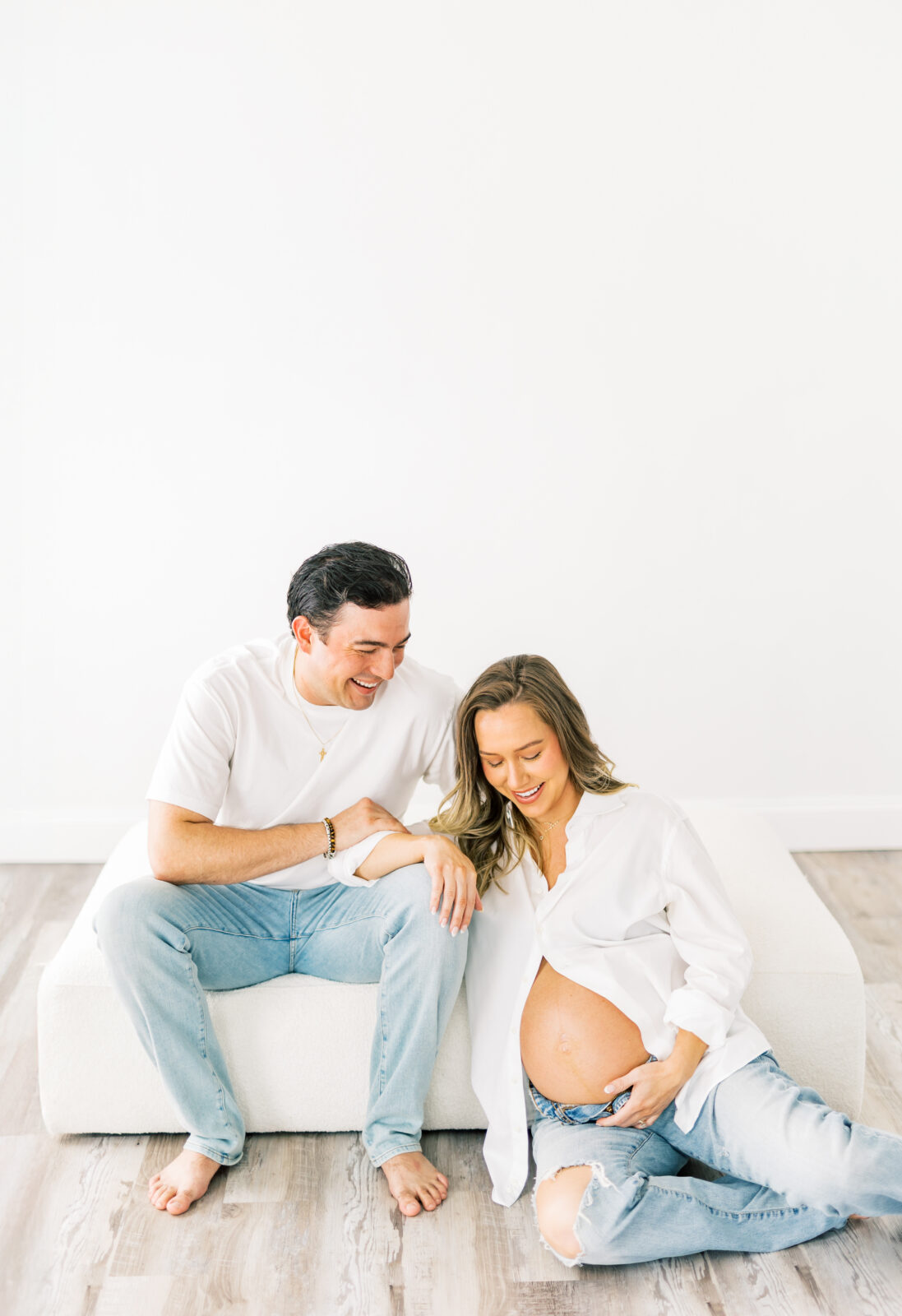Expecting parents share laughter during Dallas maternity session