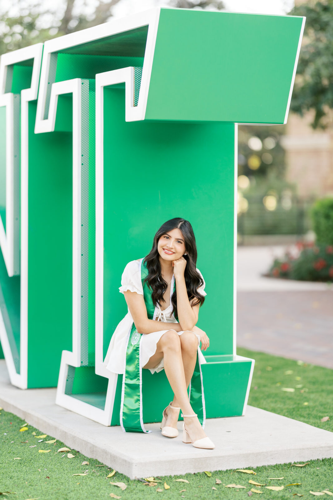 UNT senior photos at the UNT sign
