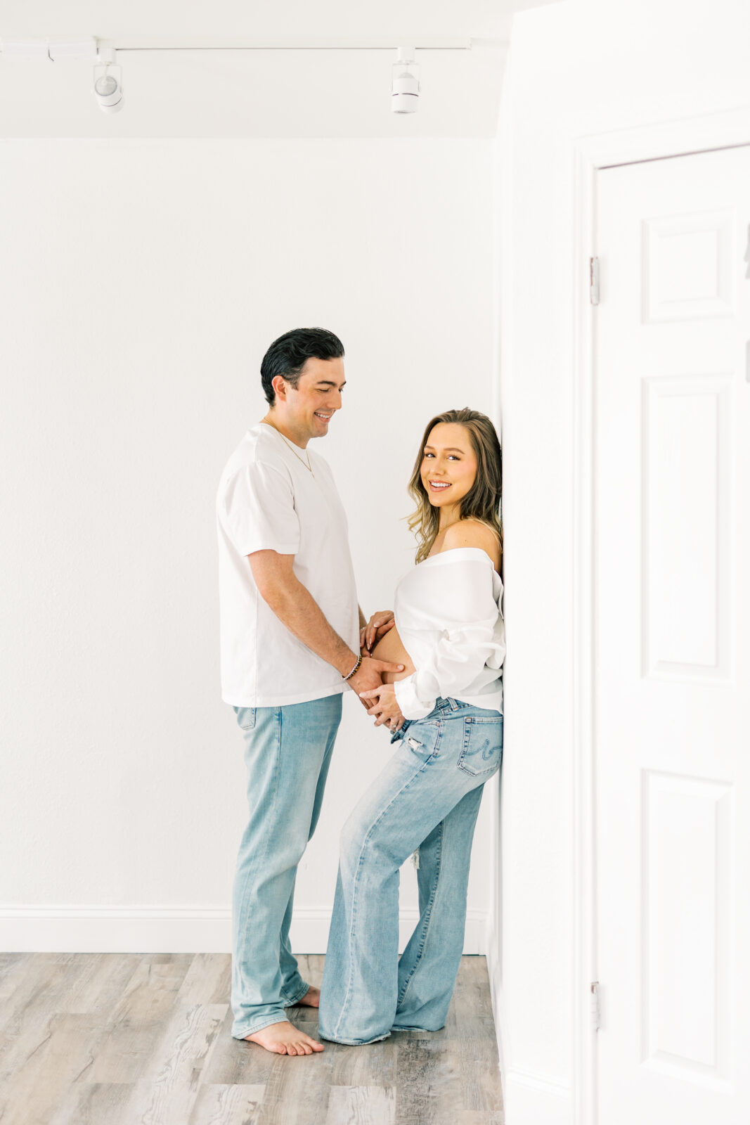 Expecting parents share laughter during Dallas maternity session