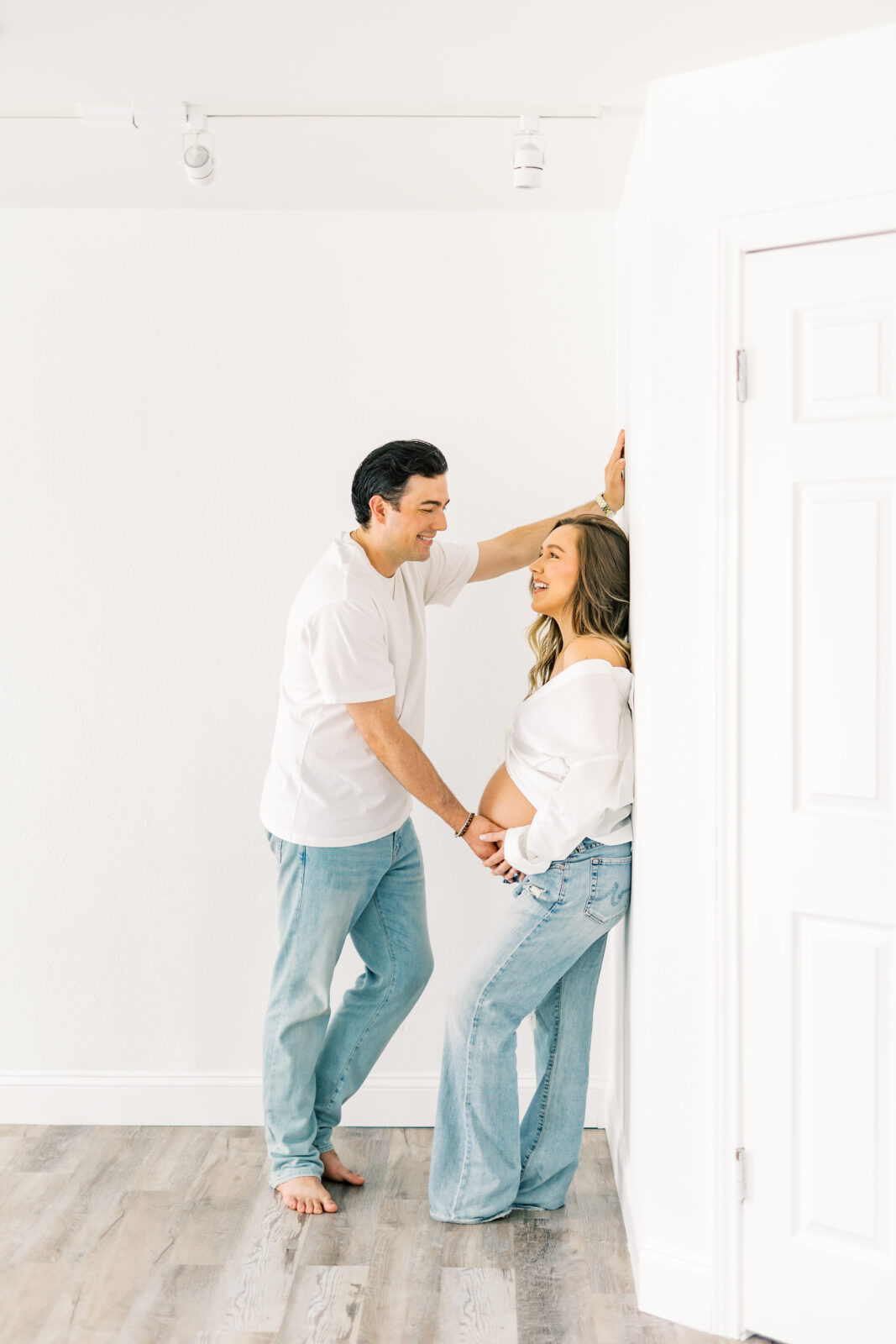Expecting parents share laughter during Dallas maternity session