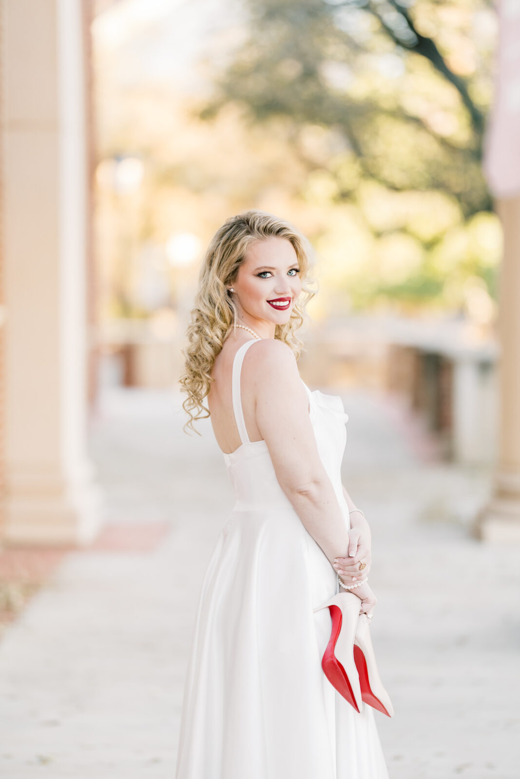 Avery walking in her Louboutins during Texas Woman’s University graduation photos.