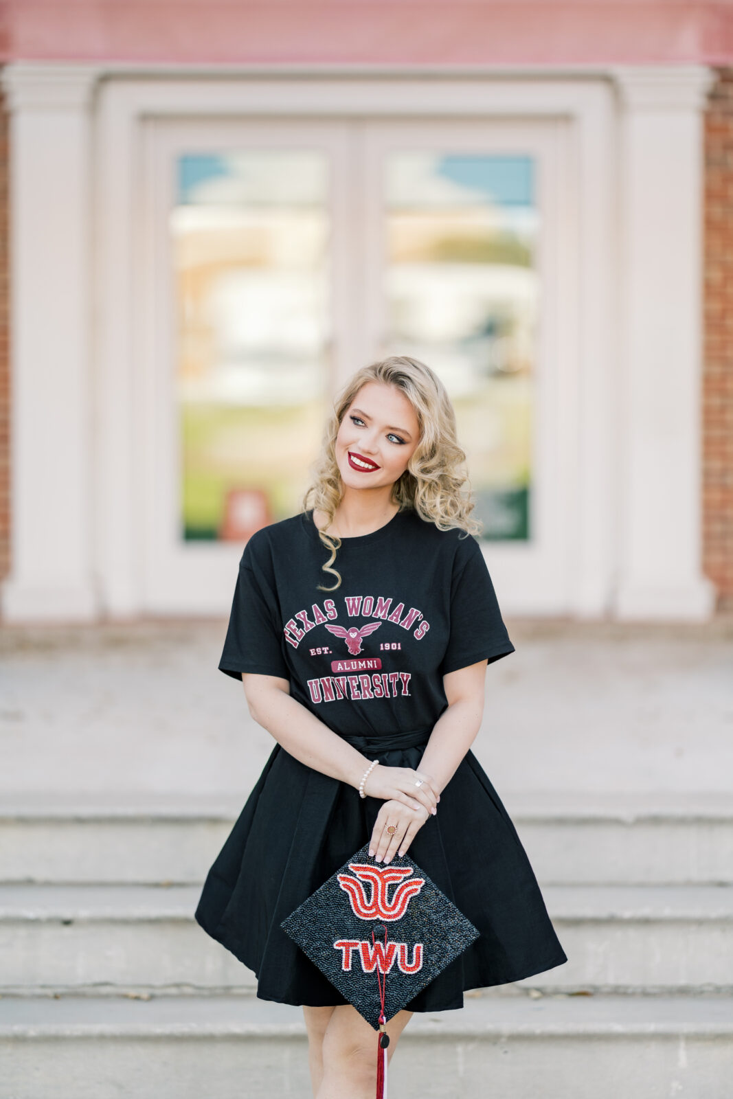 Avery in a TWU t-shirt and skirt during her graduation session.