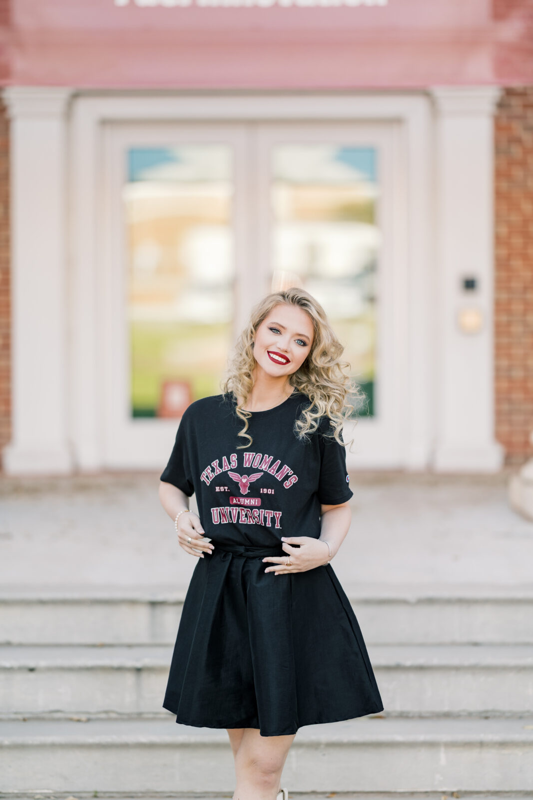 Avery in a TWU t-shirt and skirt during her graduation session.