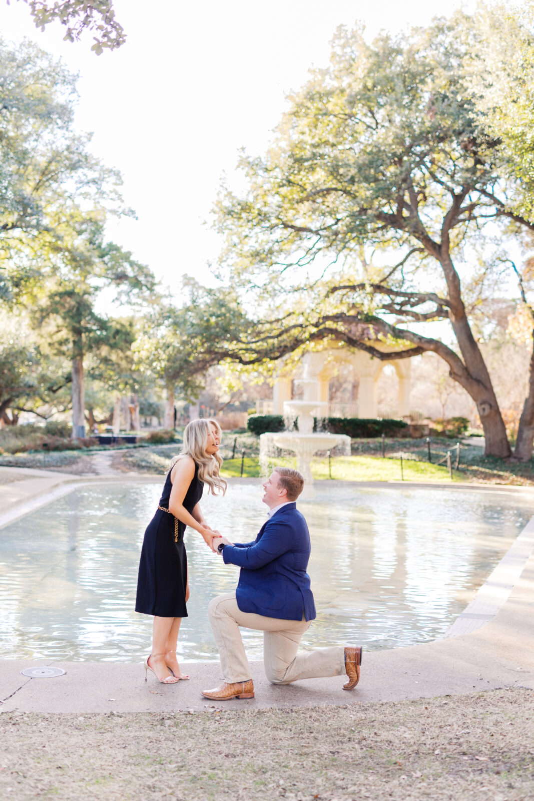 Surprise proposal at Flippen Park fountain in Highland Park, Texas.