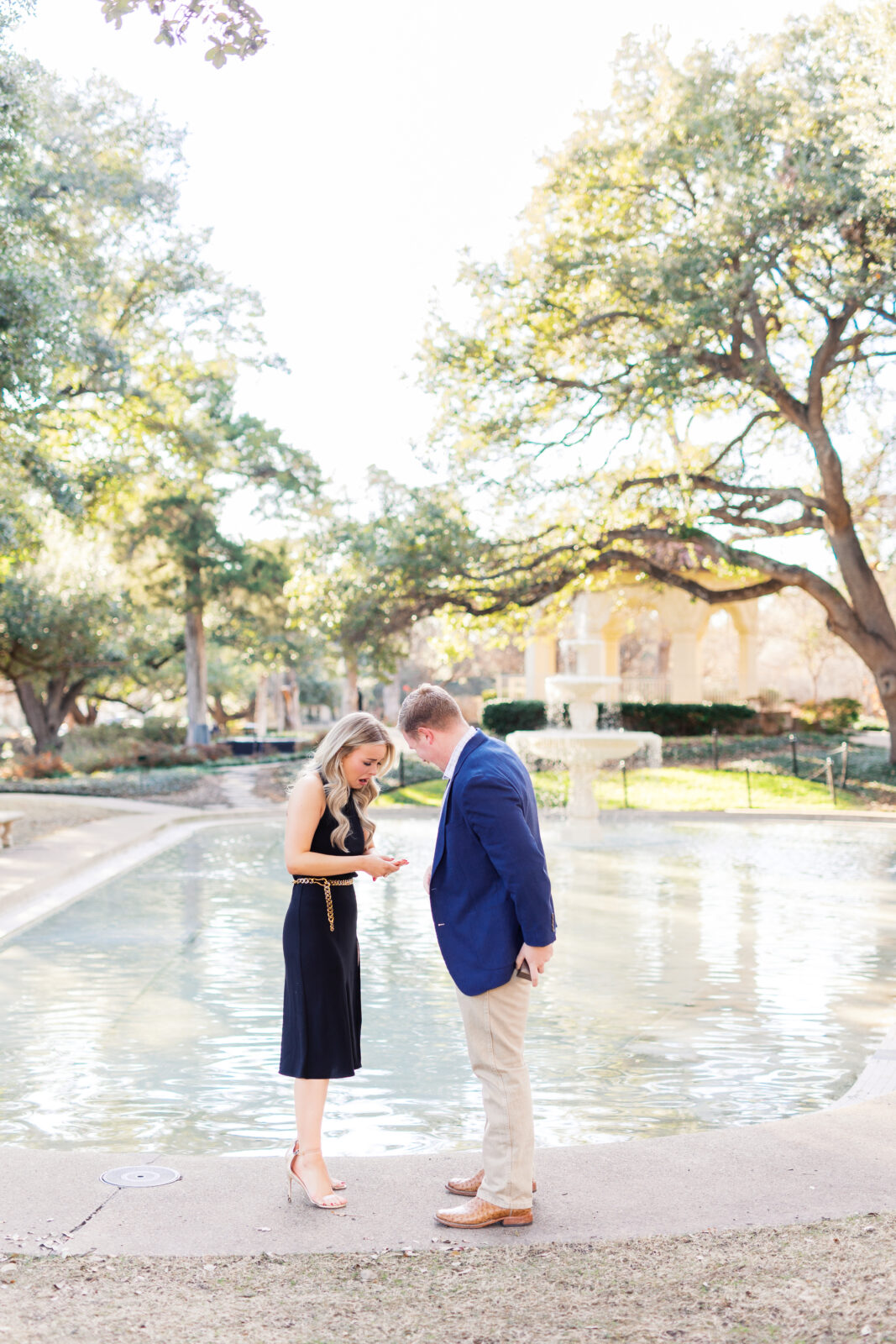 Surprise proposal at Flippen Park fountain in Highland Park, Texas.