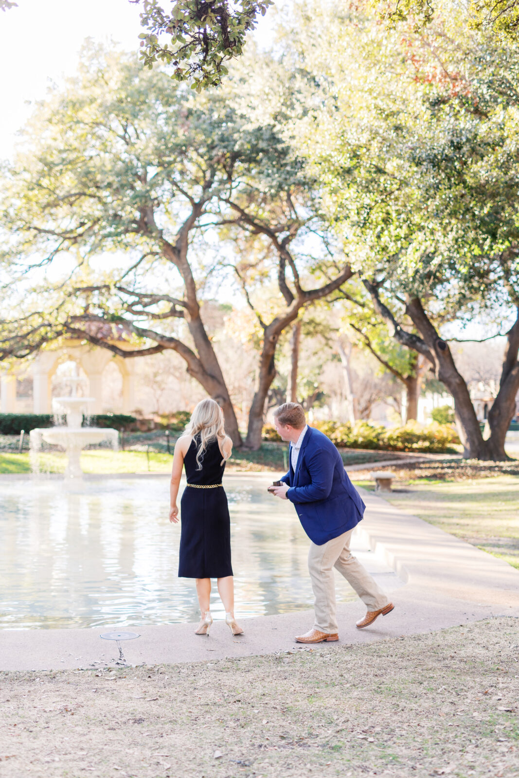 Surprise proposal at Flippen Park fountain in Highland Park, Texas.