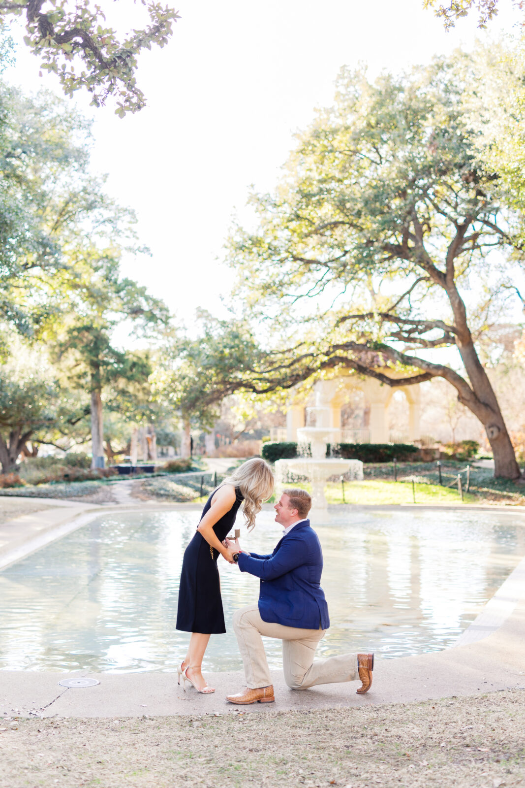 Surprise proposal at Flippen Park fountain in Highland Park, Texas.