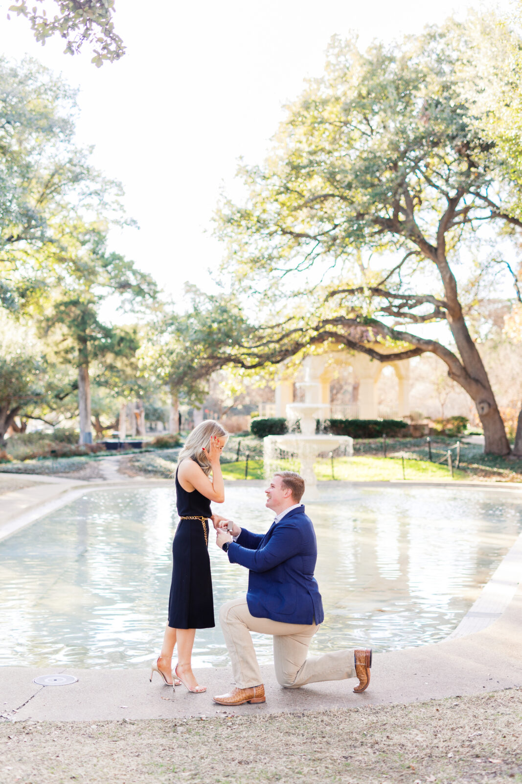 Surprise proposal at Flippen Park fountain in Highland Park, Texas.