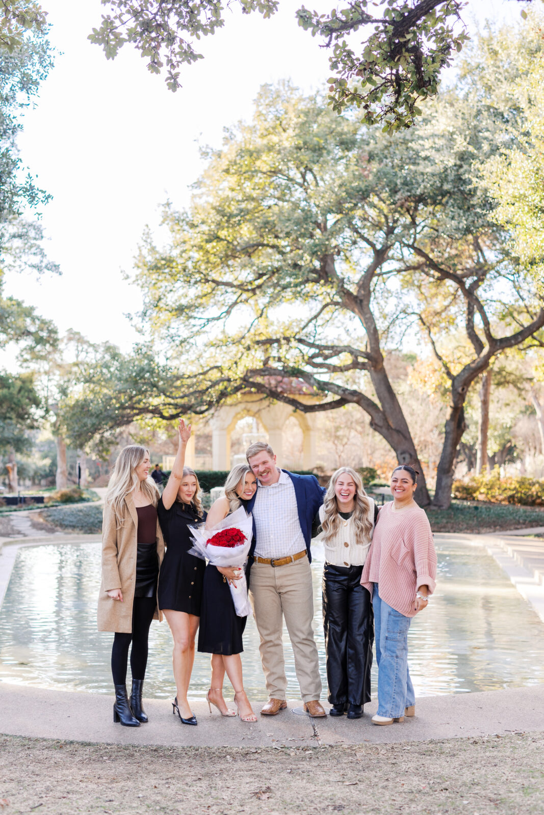 Friends surprising couple after Highland Park proposal.