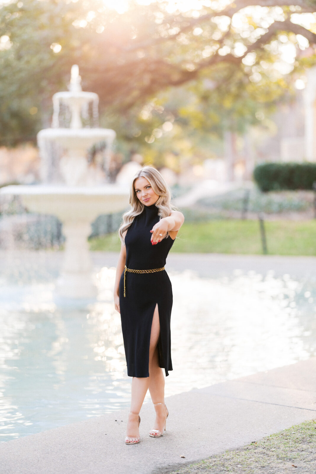 Bride-to-be posing with engagement ring during engagement photo session.