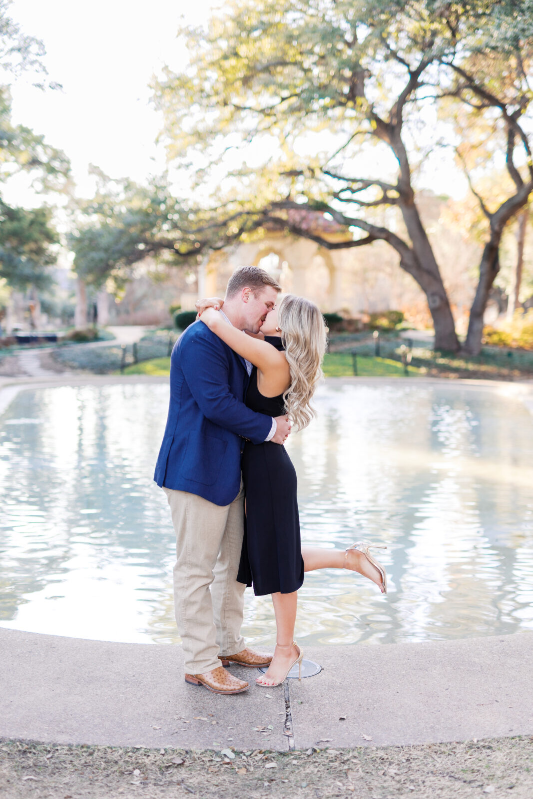 Surprise proposal at Flippen Park fountain in Highland Park, Texas.